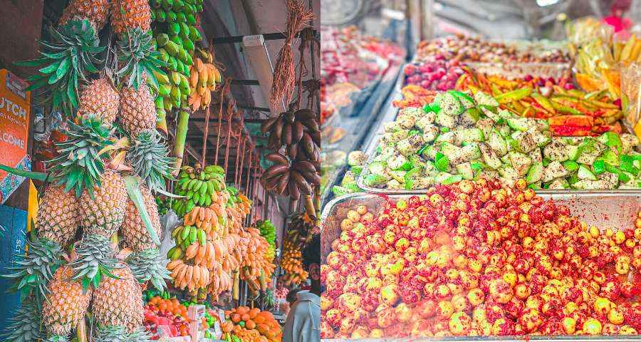 A colorful fruit stall showcasing tropical fruits and pickles in Colombo
